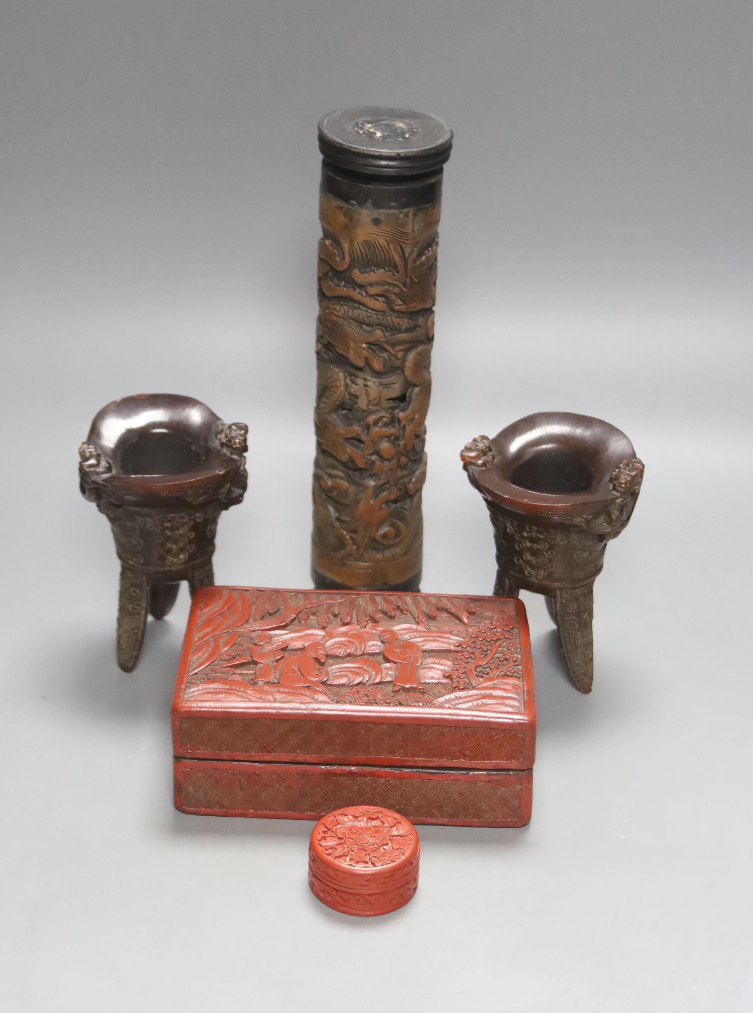 A Chinese carved wood perfume holder, two horn tripod vessels, a cinnabar lacquer box and cover and another box and cover, 19th/20th century